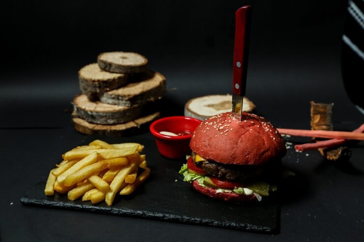 front-view-meat-burger-with-fries-ketchup-mayonnaise-stand-with-knife_141793-12201